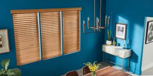 Wood shutters in a room with blue walls