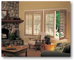 Partly open hybrid shutters in a living room