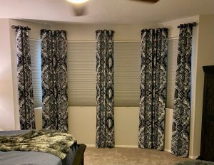 Side panel drapes with room darkening Powerview Hunter Douglas duette shades